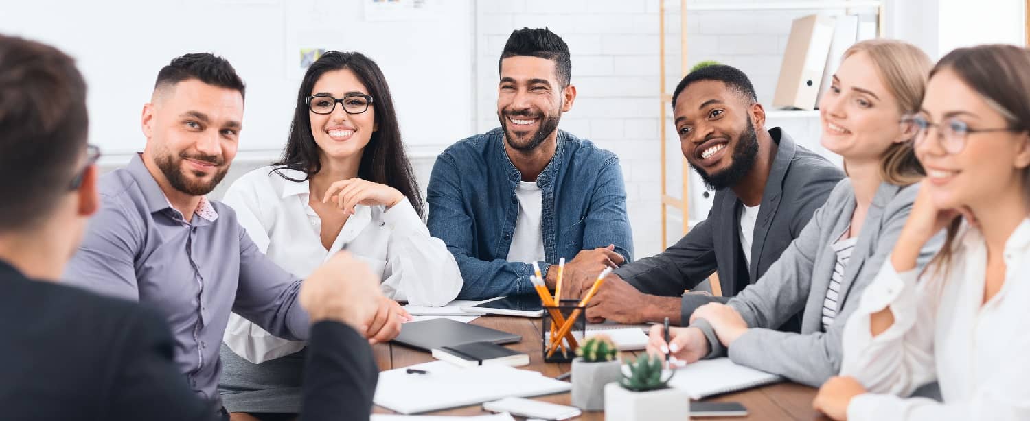 happy business team at a conference table