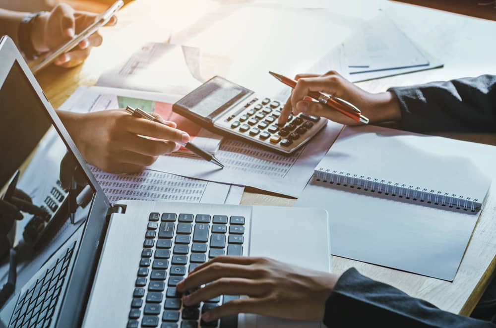 accountants using computers and calculators
