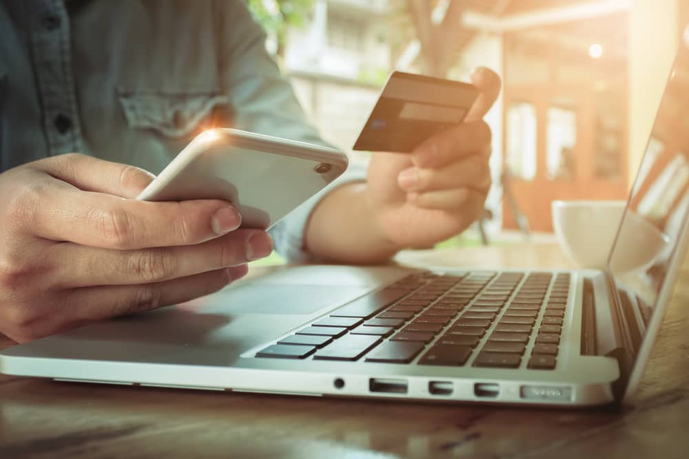 person paying by credit card