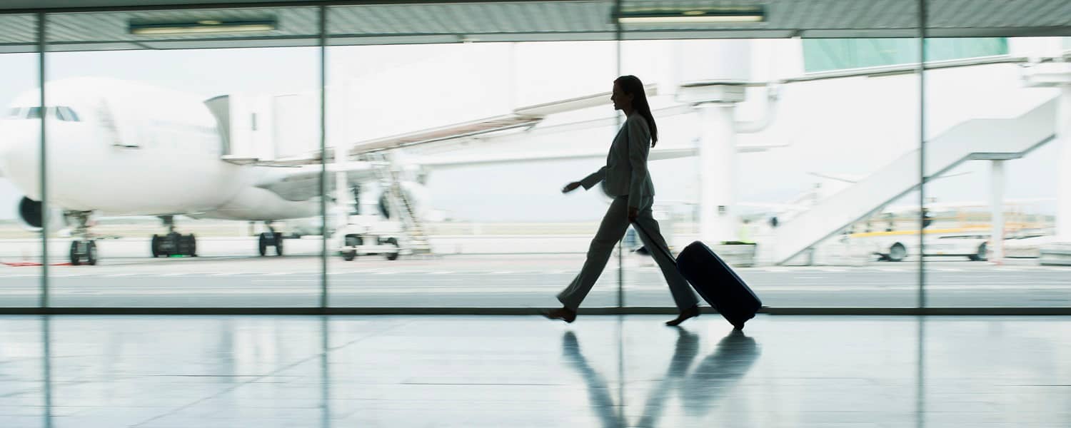 Businesswoman walking through an airport