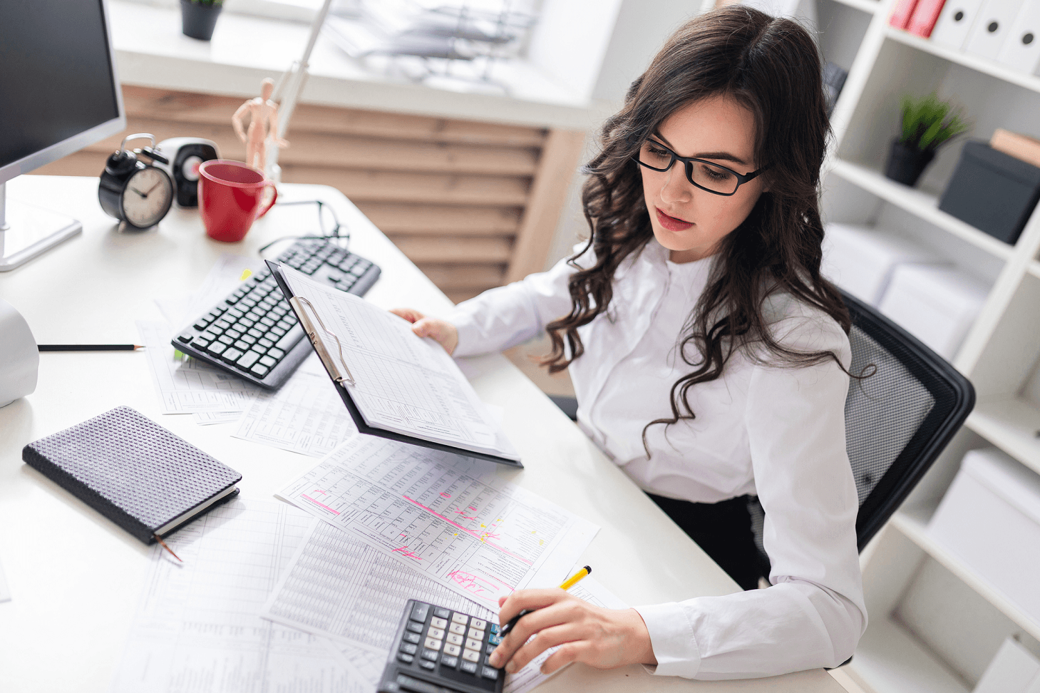 Accountant using a calculator
