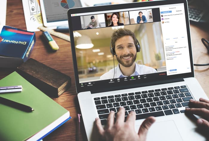 man on a video chat laptop screen