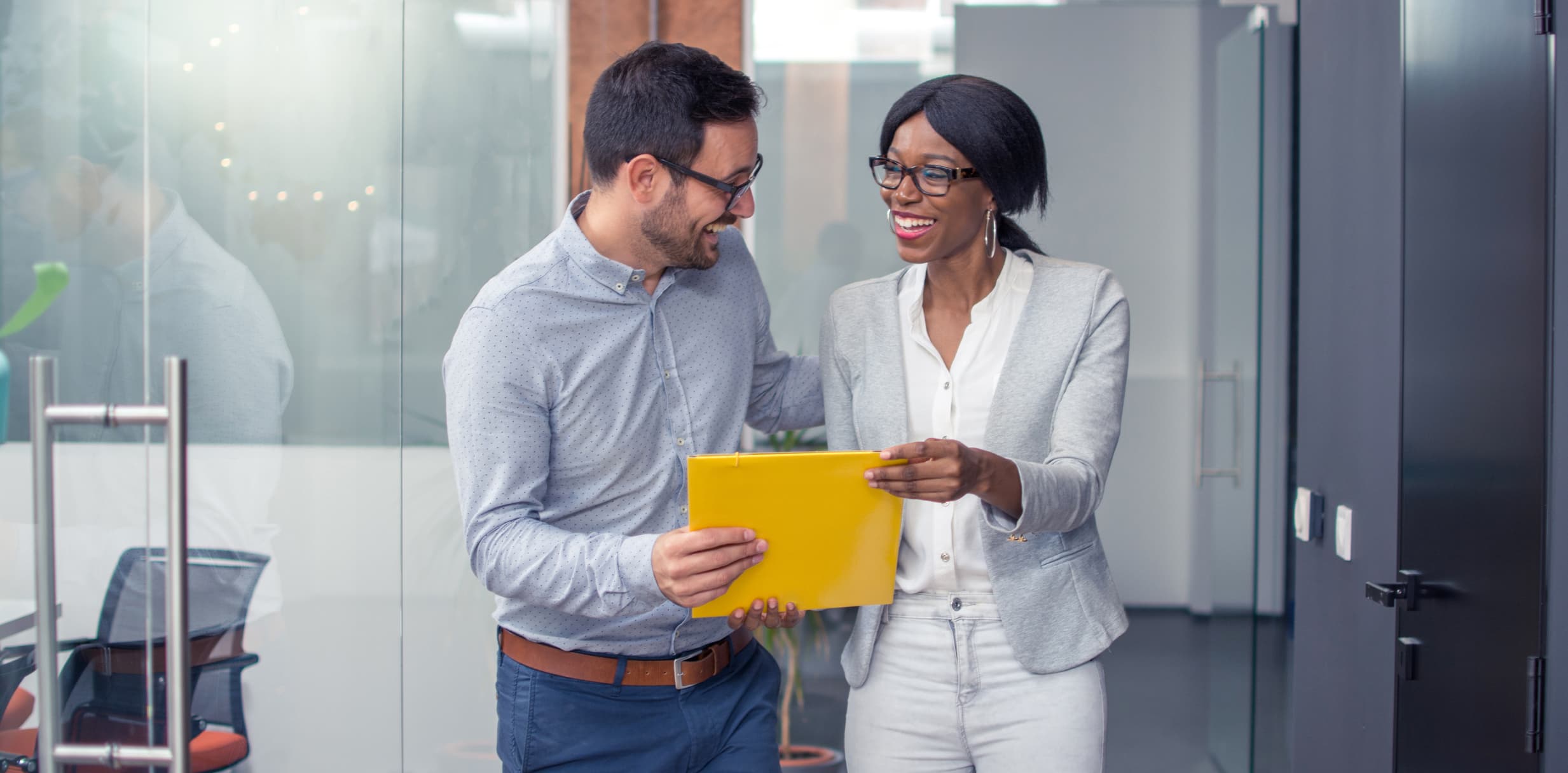 Two colleagues sharing a document