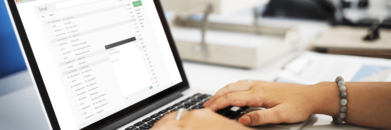 person typing on a laptop