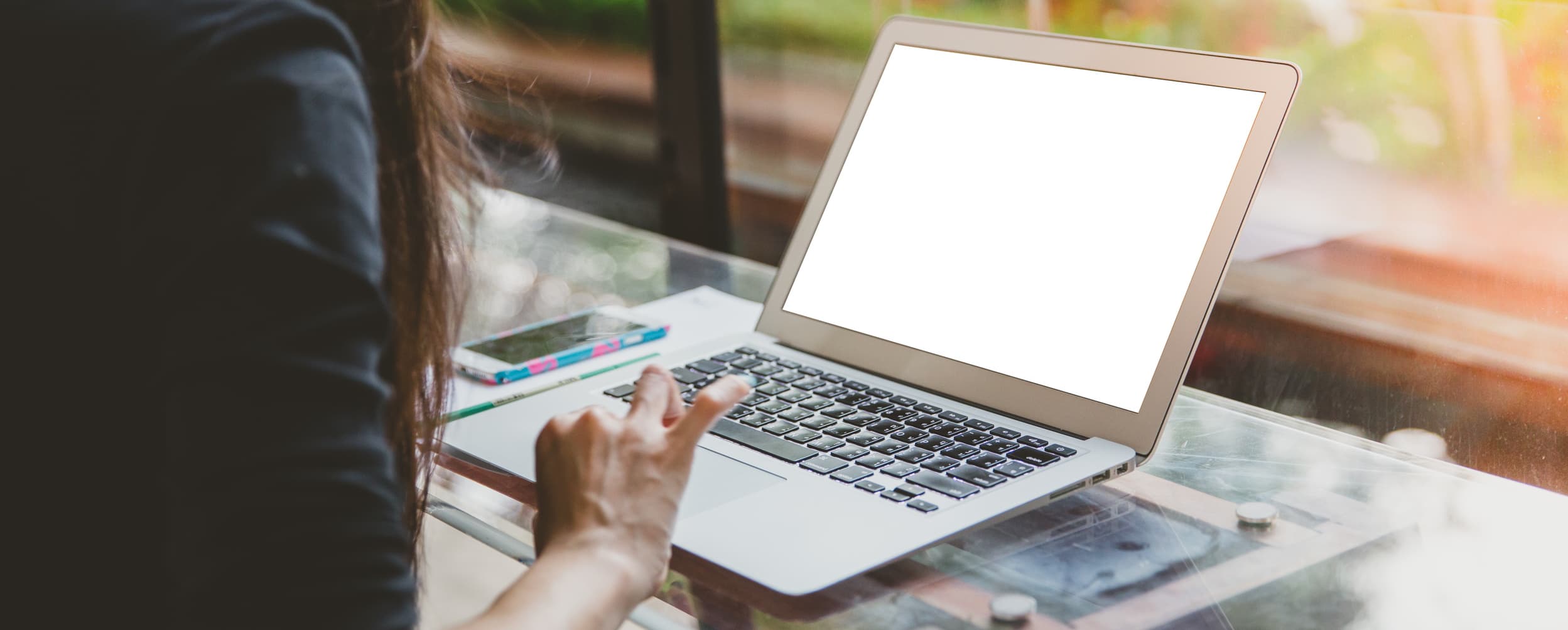 person typing on a laptop