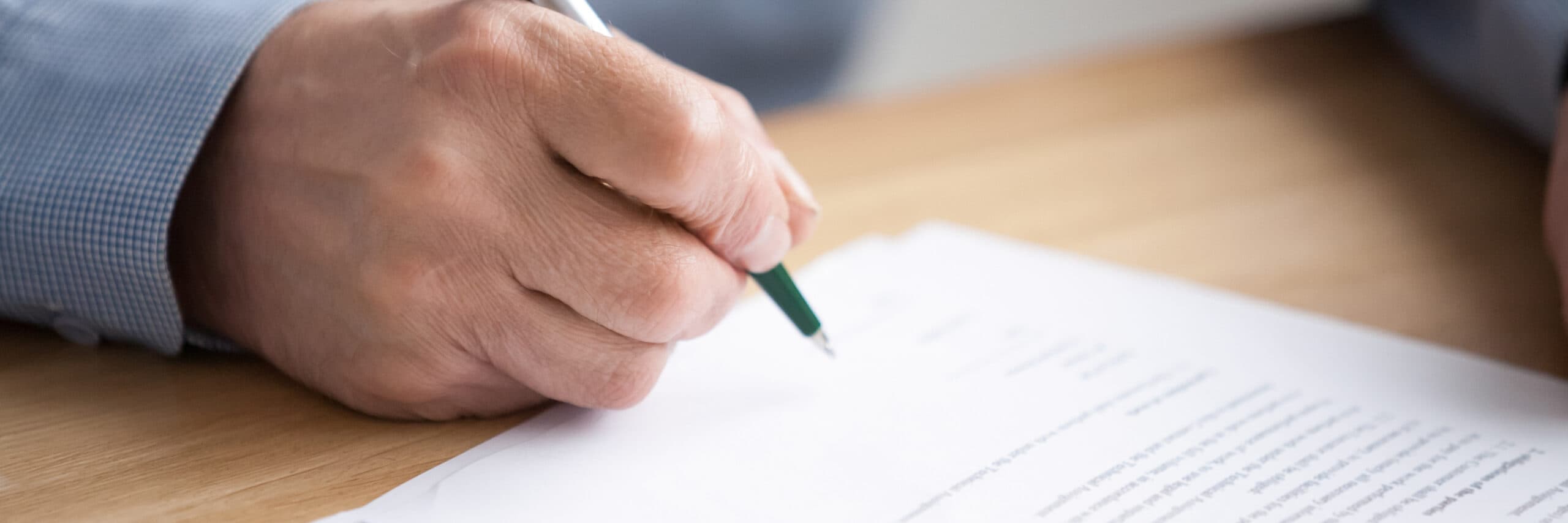 hand signing a contract
