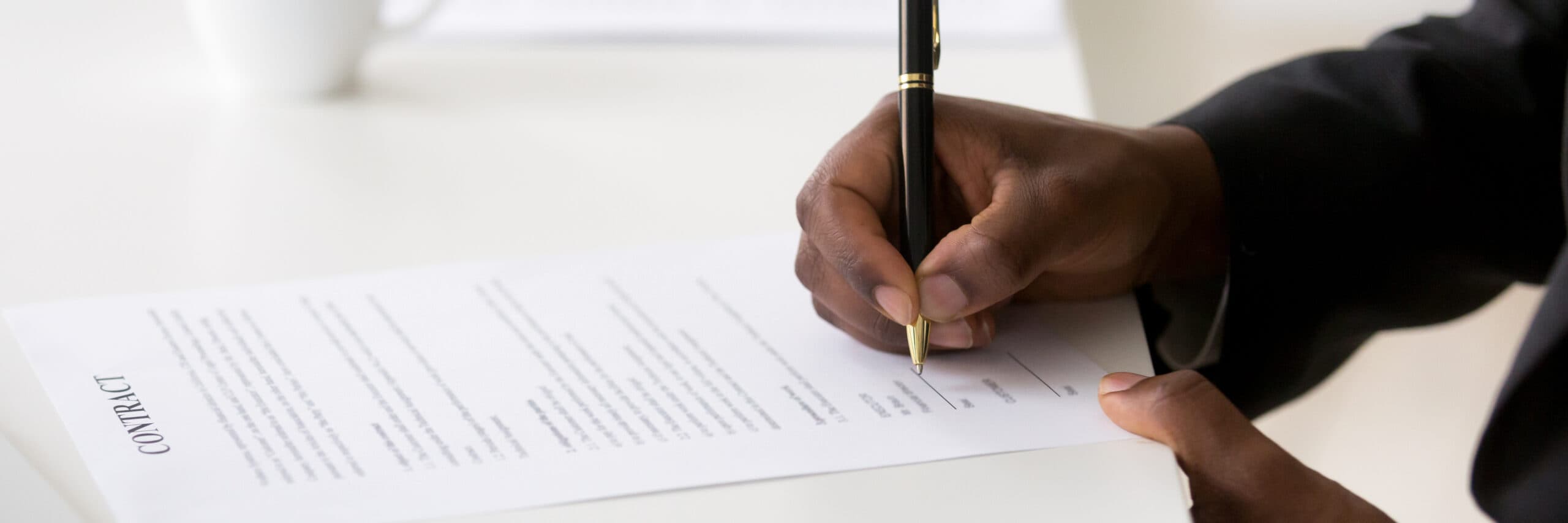 person signing a contract