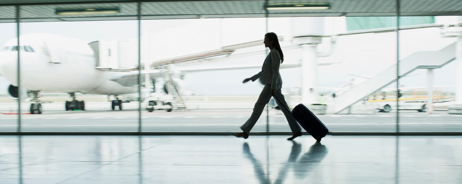 Businesswoman walking through an airport