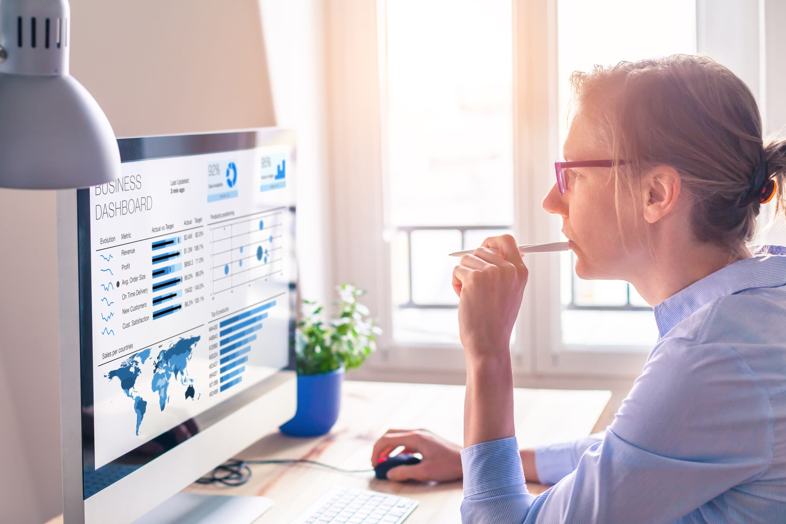 woman looking at computer data
