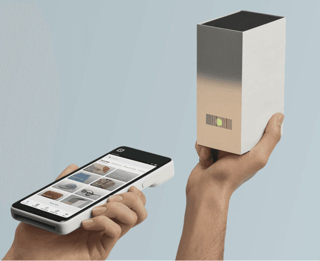 Square Handheld scanning a product barcode with its built-in scanner