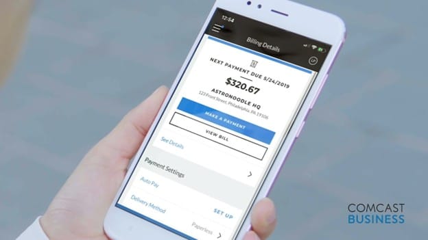 Comcast Business mobile app displaying billing and account management information on a smartphone.