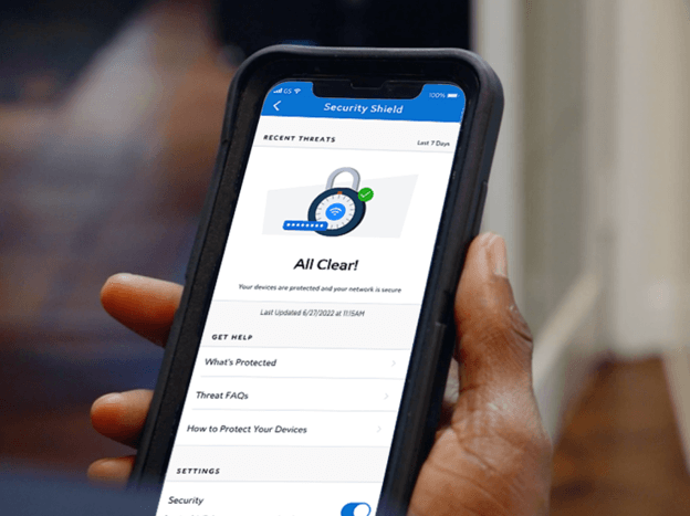 Spectrum Security Shield displaying network security and recent threats on a smartphone
