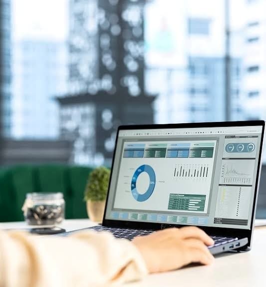 CareCloud analytics dashboard displayed on a laptop.