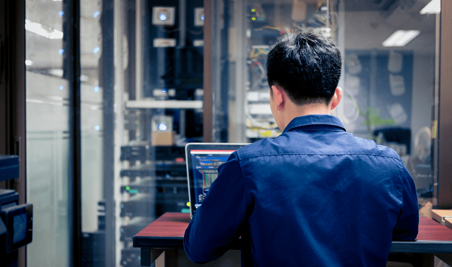 Computer technician on a computer