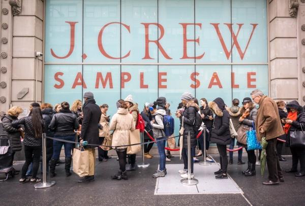 people standing outside of a J Crew sample sale